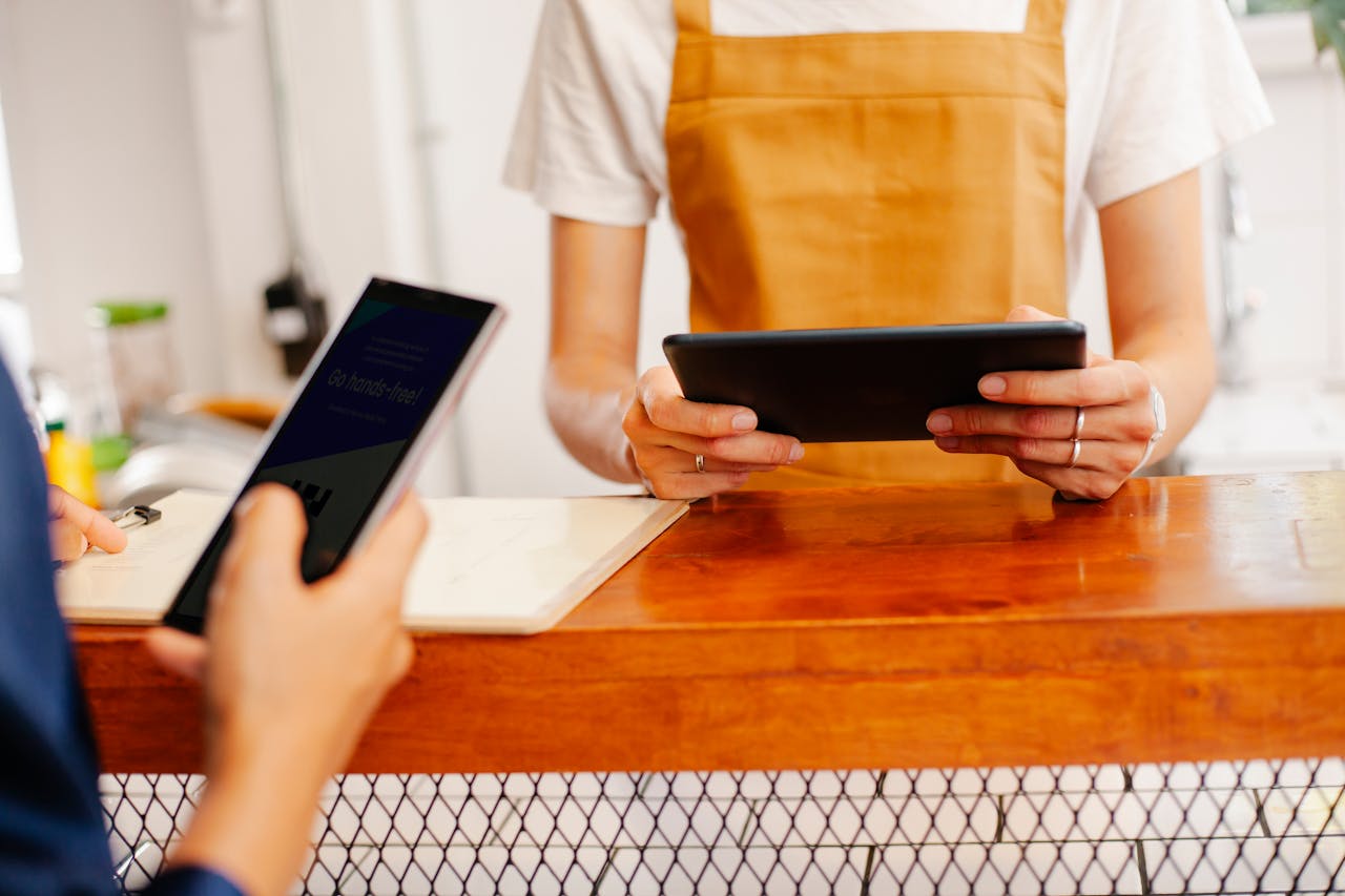 cafeteria-using-smartphone-and-POS device-at-counter