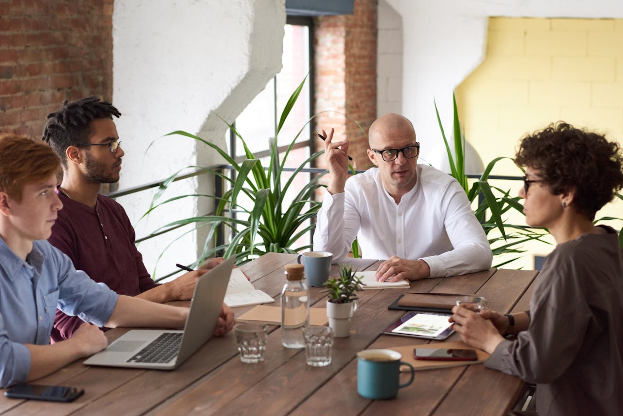 fintech acquisitions people at a meeting